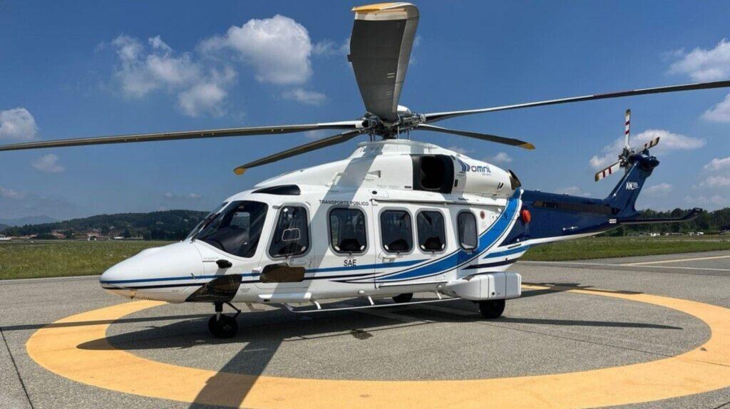 AW189K helicopter at helipad on mission to Omni Helicopters International